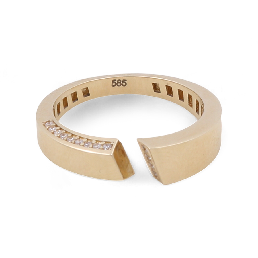 The Miral Jewelry 14K Yellow Gold Fashion Women Ring showcases an open-ended design adorned with a row of small embedded diamonds and a "585" mark on the inner side. This elegant piece enhances any look with its sparkling cubic zirconia accents.