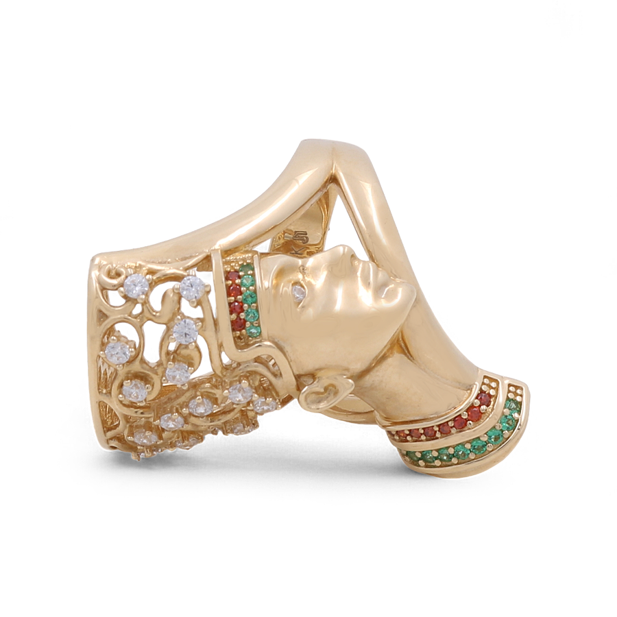 The Miral Jewelry 14K Yellow Gold Fashion Women's Ring features an intricately detailed face adorned with a headdress and collar, embellished with vibrant green and red cubic zirconia as well as clear crystals.