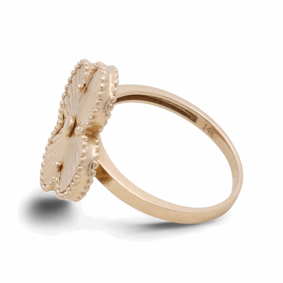 A women's fashion ring from Miral Jewelry, crafted in 14K yellow gold, showcasing a stunning flower design with intricate textural details.