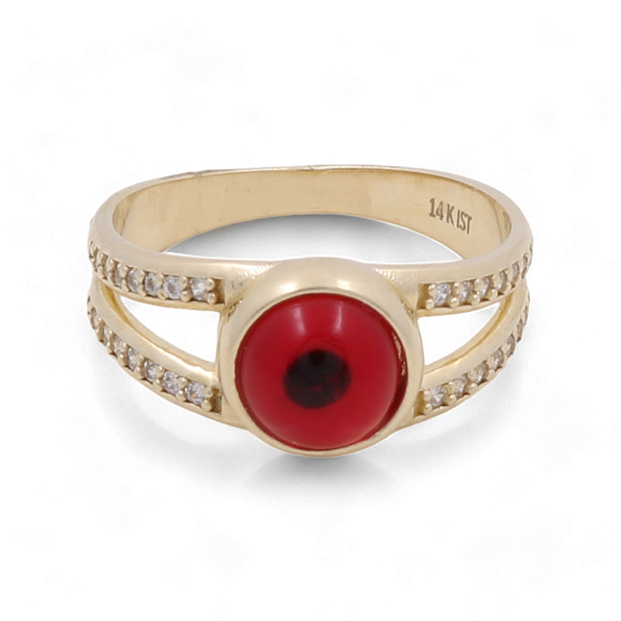 The Miral Jewelry 14K Yellow Gold Fashion Evil Eye with Zirconias Women's Ring features a double band adorned with small zirconias and a striking red, round center gem. The text on the band reads "14 K ST," making this eye-catching piece perfect for everyday wear.