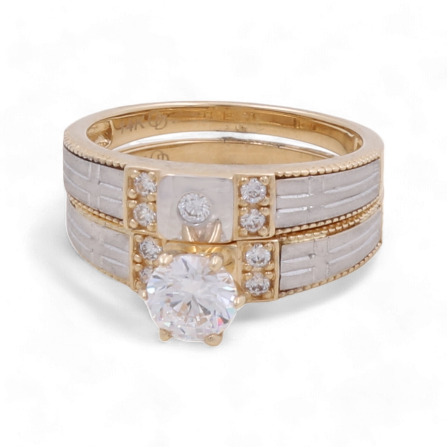 The Miral Jewelry 14K Yellow Gold Bridal Women's Ring features a large round central diamond, complemented by smaller rectangular and round diamonds, all set against a white background.