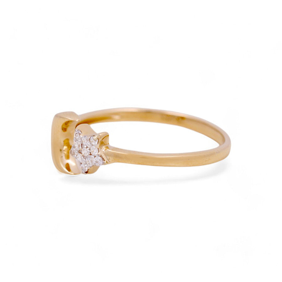 The Miral Jewelry 14K Yellow Gold Fashion Women's Ring showcases a luxurious design with a central star-shaped cluster of petite diamonds, making it an ideal elegant statement piece for the fashion-forward woman.