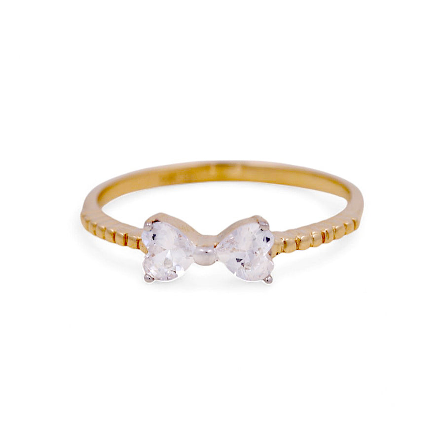 Miral Jewelry's 14K Yellow Gold Fashion Women's Ring features a bow-shaped design with two clear gemstones.