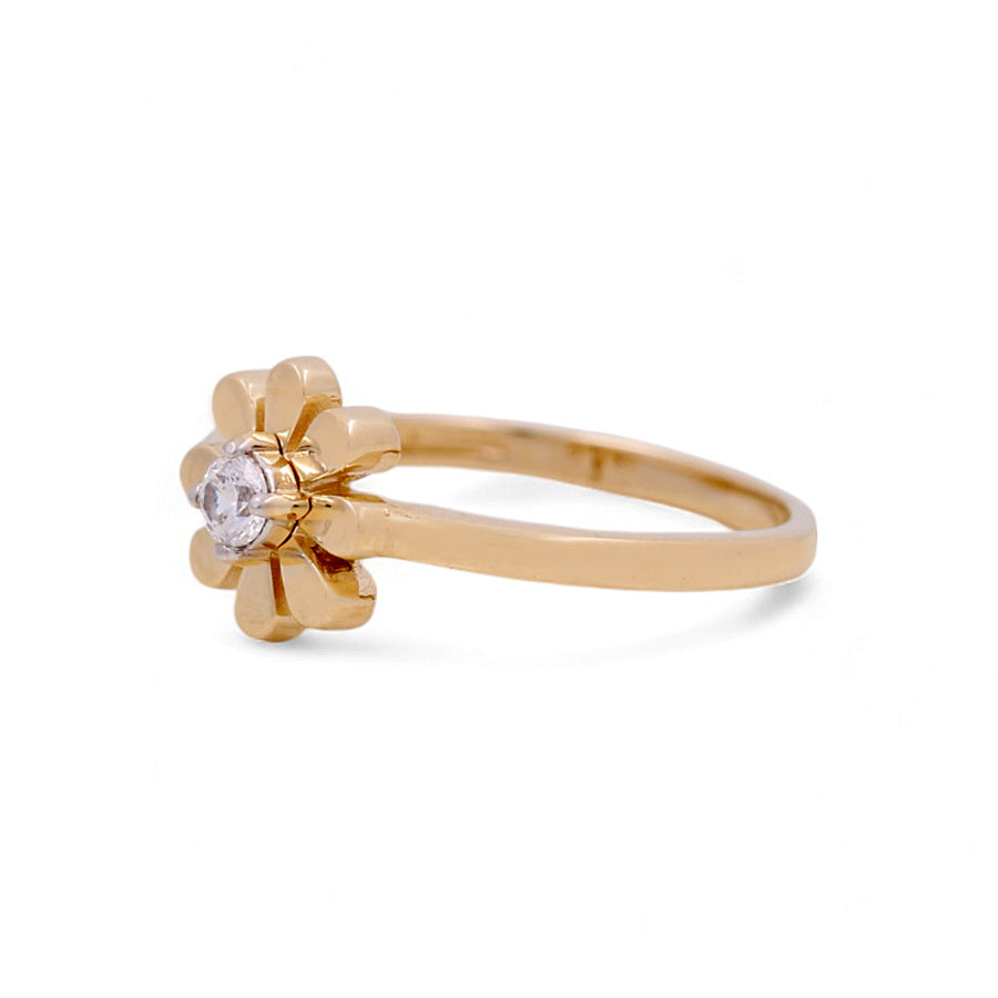 Introducing the Miral Jewelry 14K Yellow Gold Flower Fashion Women's Ring, an exquisite piece artfully crafted with a flower-shaped design and a central clear gemstone.