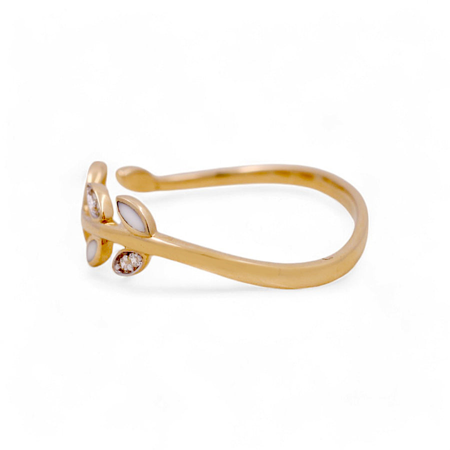 Introducing the 14K Yellow Gold Fashion Women's Ring by Miral Jewelry, designed with elegant open ends and adorned with leaf-shaped accents and three delicate round stones.