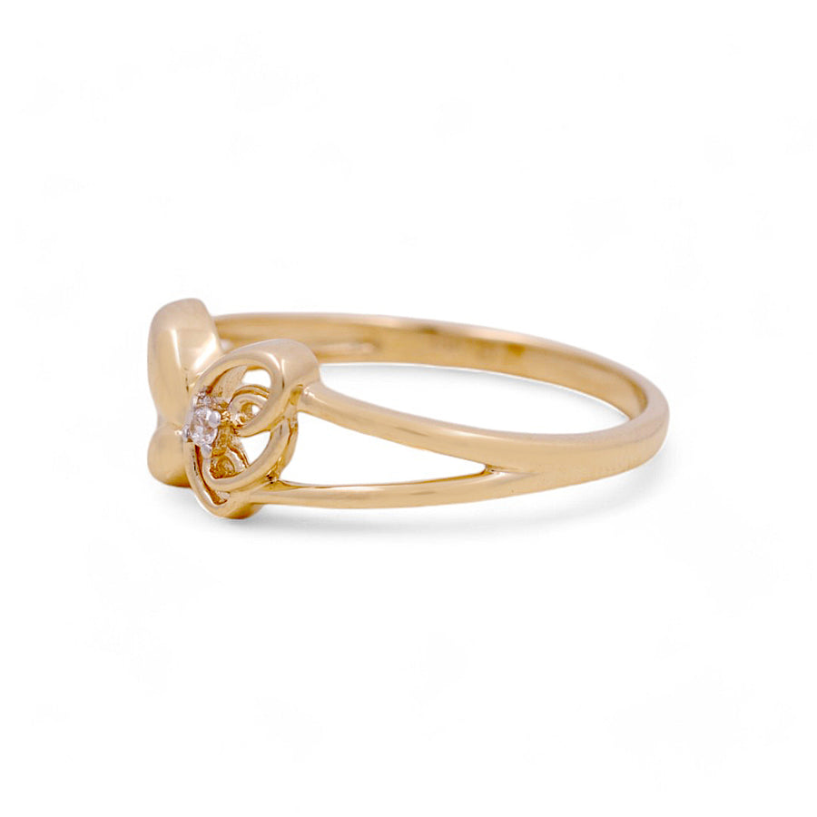 The 14K Yellow Gold Butterfly Fashion Women's Ring by Miral Jewelry features an exquisite small diamond set in a distinctive open design.