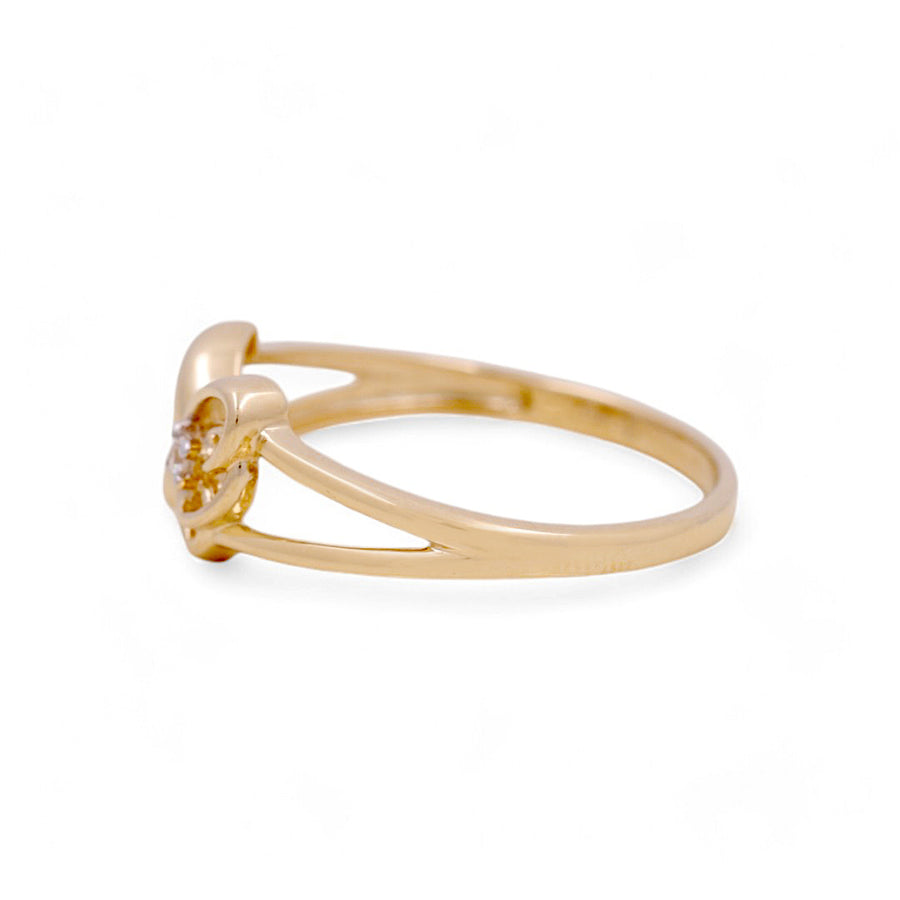 The Miral Jewelry 14K Yellow Gold Butterfly Fashion Women's Ring showcases a simple, thin band and a small, round setting when viewed from the side.