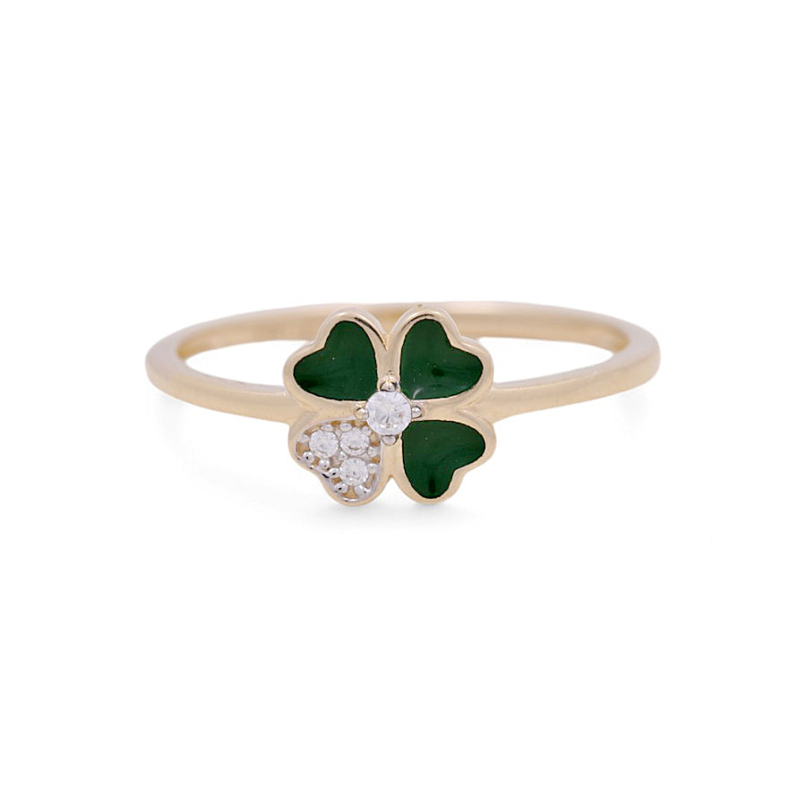 This elegant women's ring by Miral Jewelry showcases a clover-shaped design, crafted in 14K yellow gold, and embellished with green and white stones.