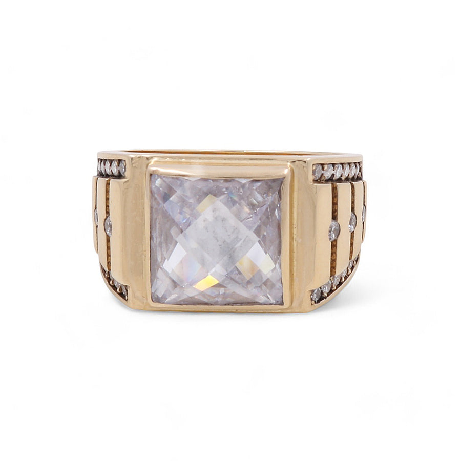 A luxurious piece, this 14K Yellow Gold Fashion Men's Cubic Zirconias Ring by Miral Jewelry showcases a large square-cut clear gemstone at the center, flanked by vertical lines and small round gems on each side.