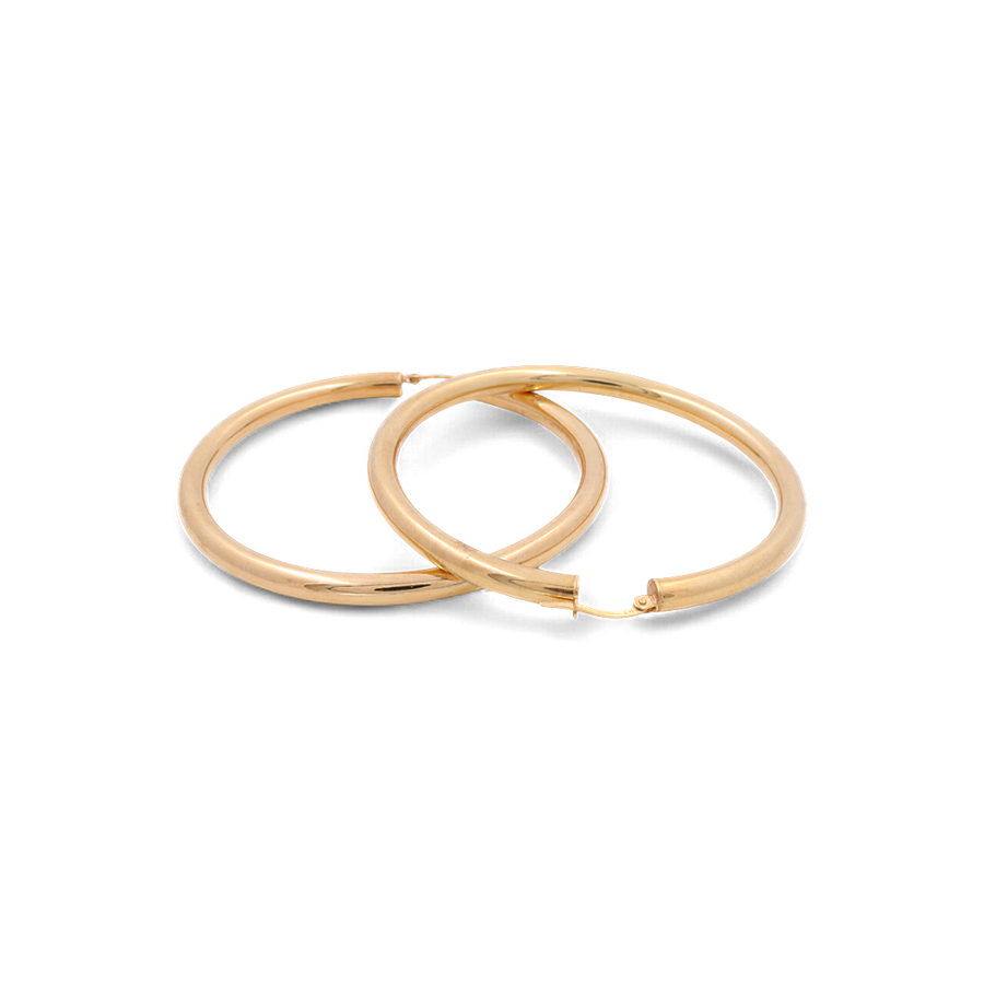 The 14K Yellow Gold Fashion Large Hoop Women's Earrings from Miral Jewelry are showcased on a plain white background, making them the ideal addition to elevate your women's fashion jewelry collection.