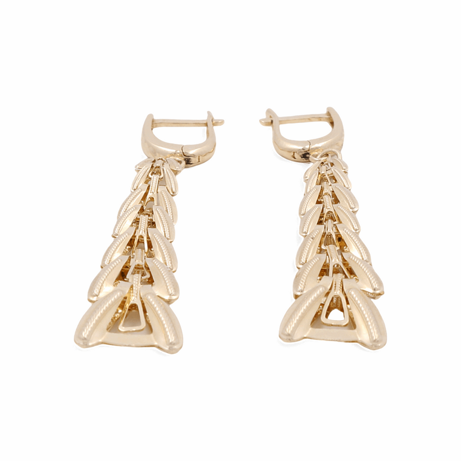 The 14K Yellow Gold Earrings by Miral Jewelry are sophisticated dangle earrings featuring a fishbone design and a secure latch-back closure. Crafted from luxurious 14K yellow gold, these link earrings exude both elegance and style.