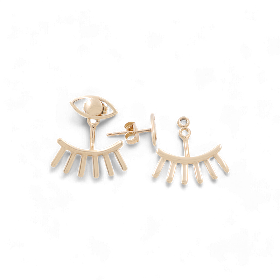 Introducing the Miral Jewelry 14K Yellow Gold Very Fancy Eye Women's Earrings, featuring one earring shaped like an eye with an attached stud and the other designed as slightly curved eyelashes.