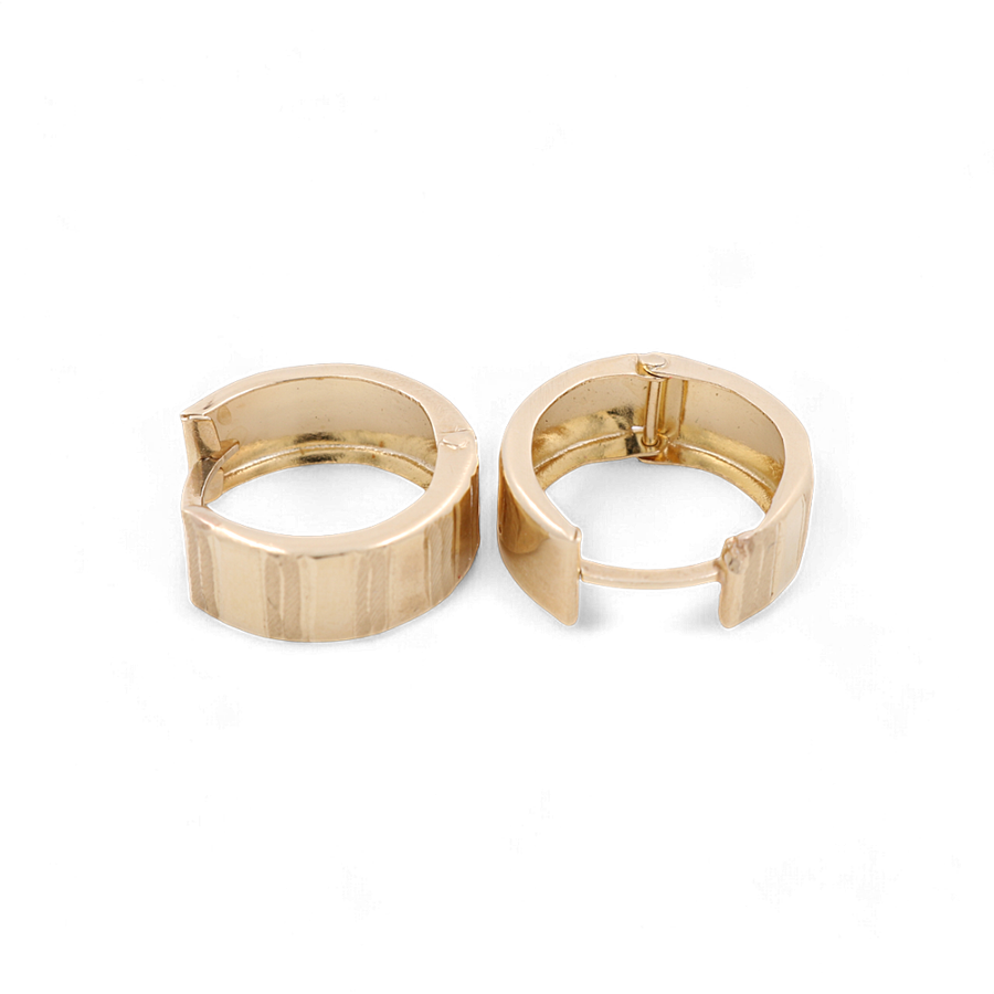 Two elegant 14K Yellow Gold Fashion Hoop Women's Earrings by Miral Jewelry, featuring a ridged texture, placed side by side on a white background.