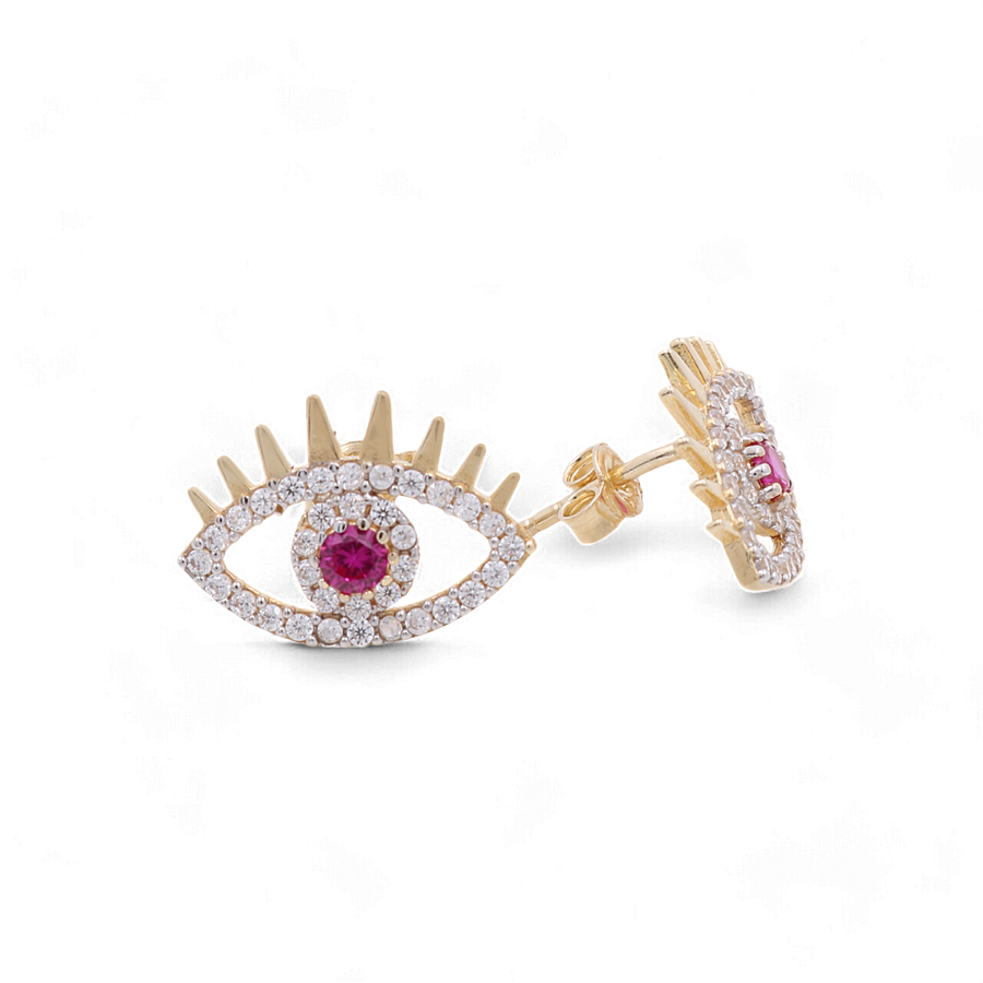 Close-up of an eye-shaped luxury earring from Miral Jewelry, crafted in 14K yellow gold and featuring a red color stone at the center, surrounded by small white CZ crystals, with a push back closure.