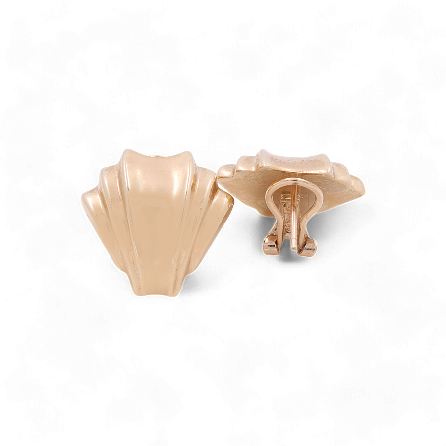 A pair of 14K yellow gold Omega women's earrings by Miral Jewelry, featuring a shell-shaped design with a textured finish in gold-tone against a white background.