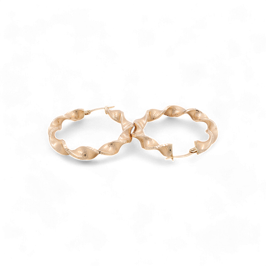 A pair of Miral Jewelry's 14K Yellow Gold Fashion Twisted Hoops Women's Earrings, exhibiting wavy textures, positioned side by side on a white background.