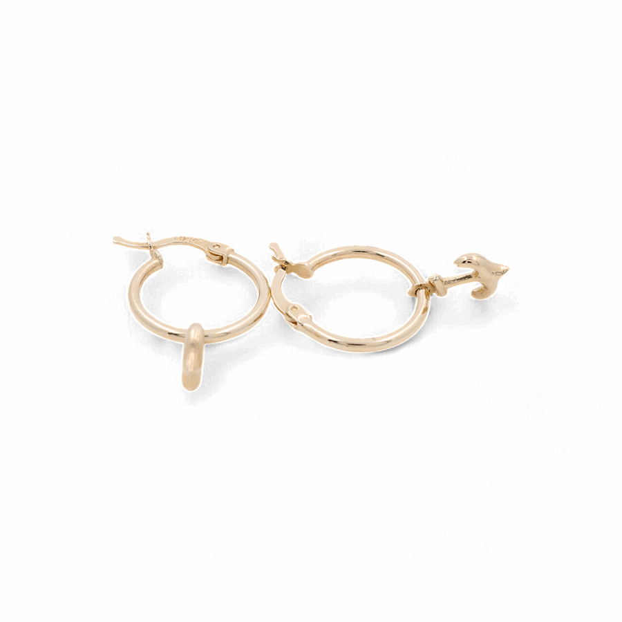 A pair of 14K Yellow Gold Ancle Small Hoop Women's Earrings by Miral Jewelry, with one featuring a charming bird design.