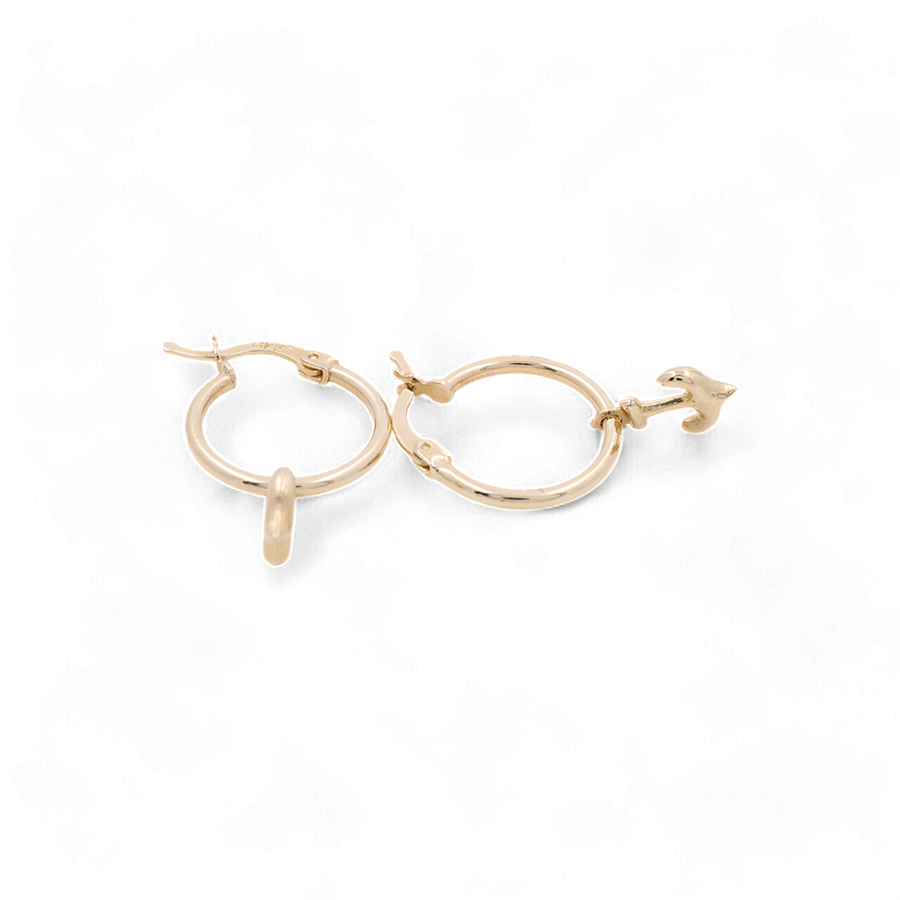 A pair of 14K Yellow Gold Ancle Small Hoop Women's Earrings by Miral Jewelry, with one featuring a charming bird design.