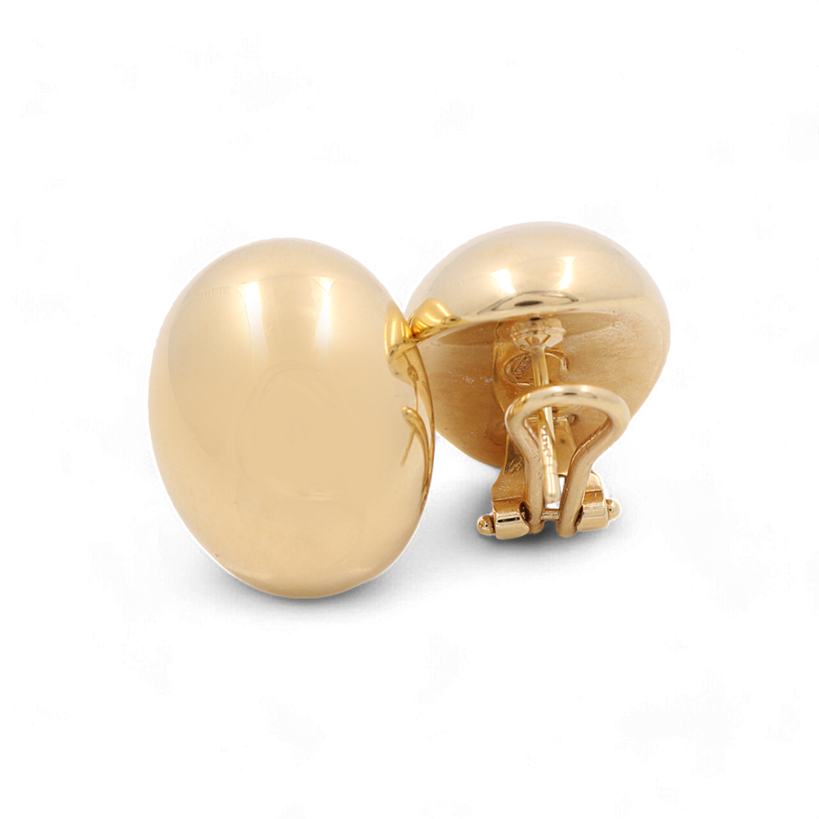 A pair of gold-toned cufflinks with a rounded design, reminiscent of the 14K Yellow Gold Oval Omega Back Women's Earrings by Miral Jewelry, displayed on a plain white background.