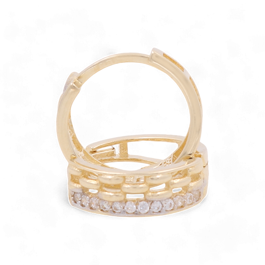 Miral Jewelry's 14K Yellow Gold Small Hoop Women's Earrings with Cz feature a stunning design, showcasing a row of small diamonds embedded along the outer surface - perfect for those who appreciate timeless elegance in women's earrings.