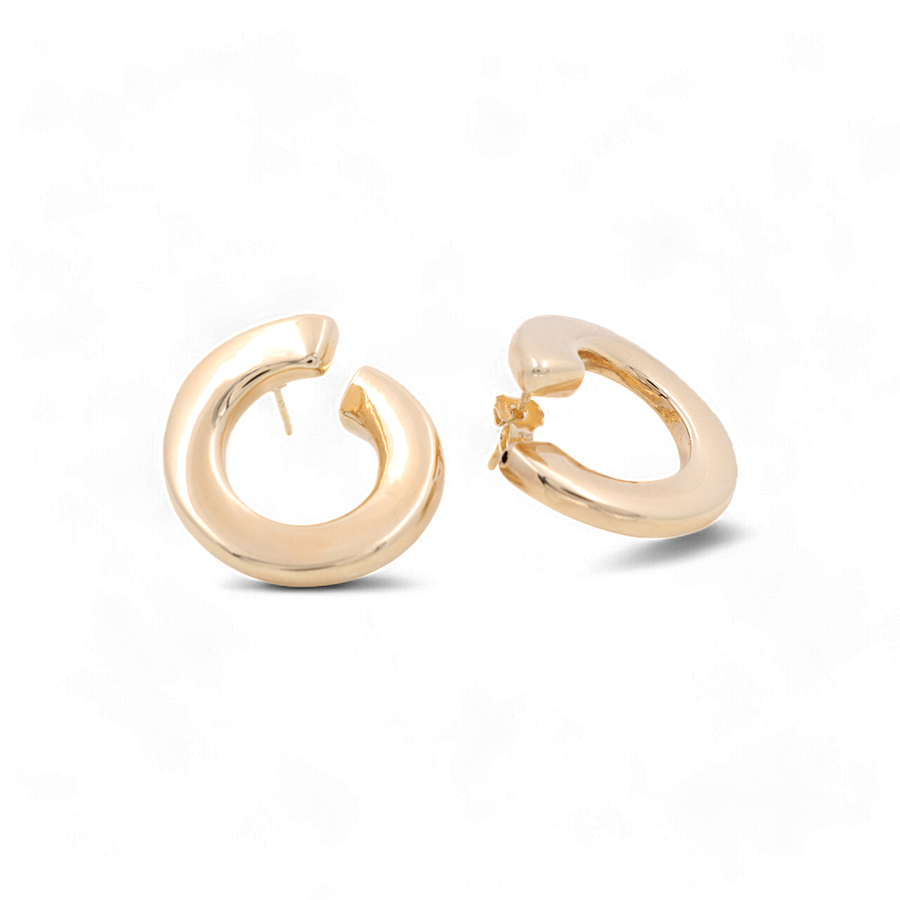 A pair of luxury jewelry, Miral Jewelry's 14K Yellow Gold Medium Stud Women's Earrings with a chunky, open design are displayed against a white background.