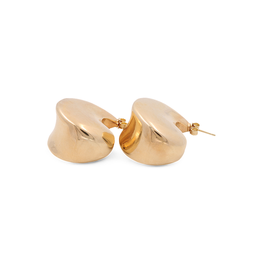 A pair of large hoop women's earrings by Miral Jewelry, crafted from 14K yellow gold with a chic post back closure.