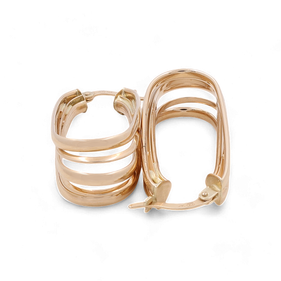 A pair of Miral Jewelry's 14K Yellow Gold Medium Hoop Earrings, showcasing a unique cutout design with three rectangular bands, beautifully displayed against a white background.