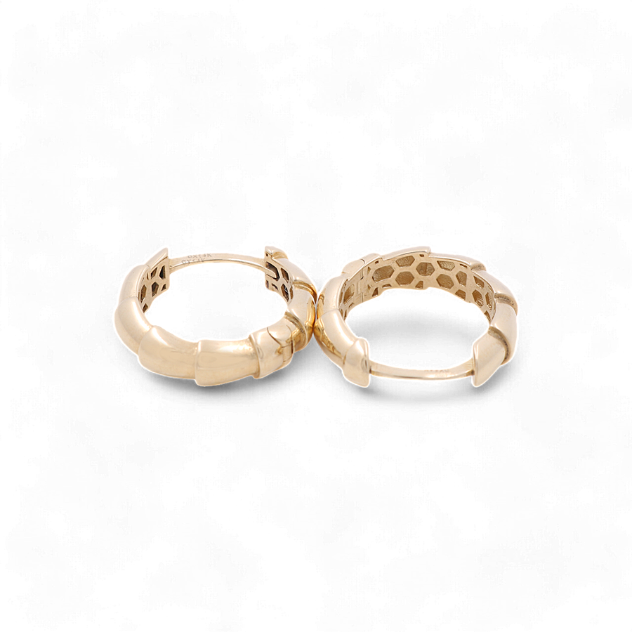 A pair of 14K Yellow Fashion Hoop Earrings from Miral Jewelry, featuring a chic, textured design with small, interconnected curved segments. Crafted from premium materials, these elegant earrings are displayed against a plain white backdrop.