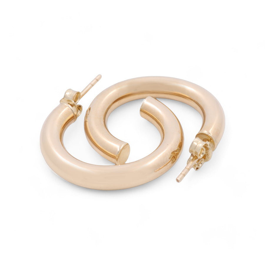 A pair of 14K yellow fashion hoop earrings by Miral Jewelry, featuring a post and clasp closure, laid flat on a white background, adding a touch of glamour to any jewelry collection.