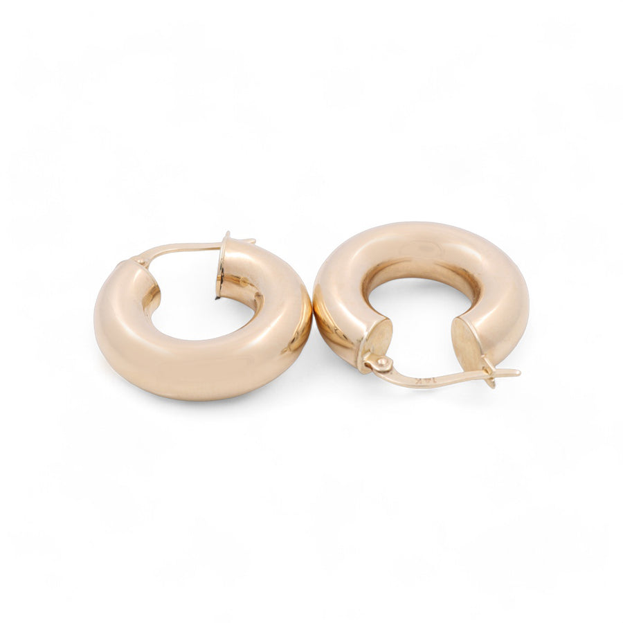 A pair of Miral Jewelry 14K Yellow Gold Fashion Hoops Earrings featuring a small, rounded, chunky design with latch back closures.