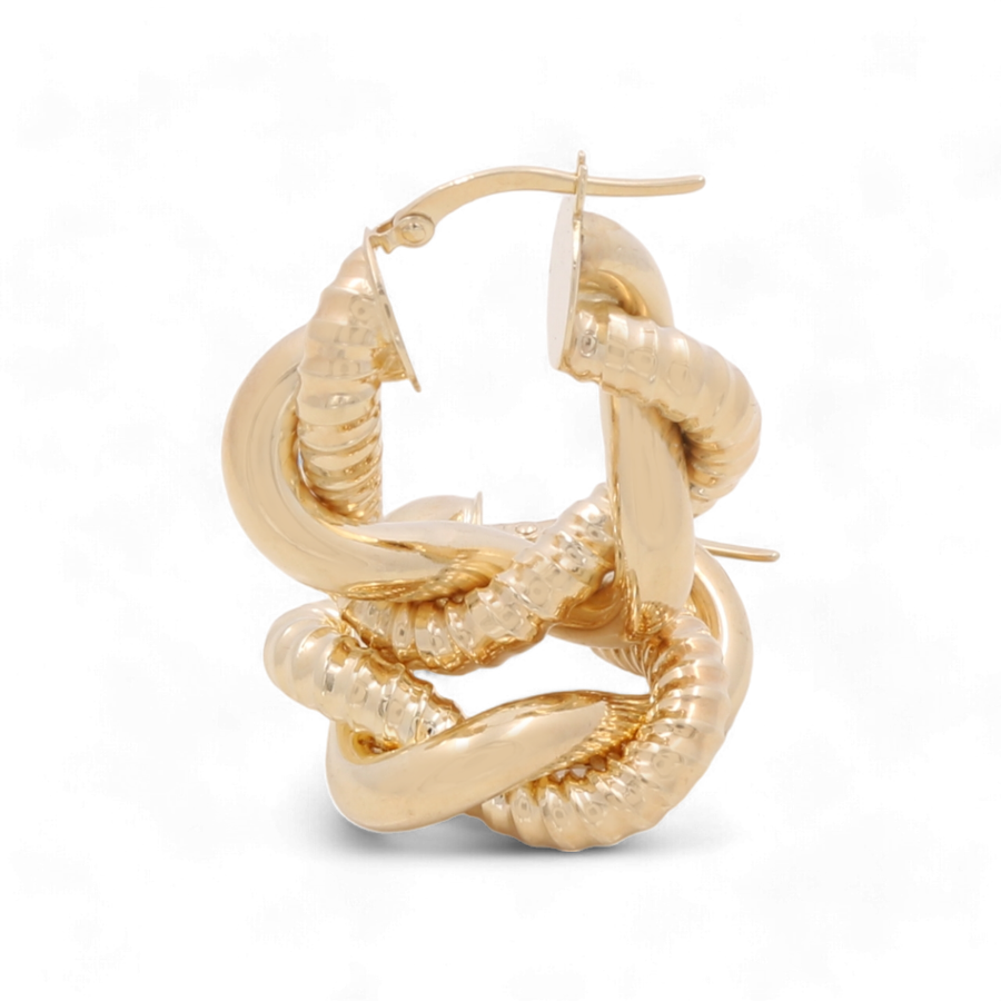 A pair of 14K Yellow Fashion Hoop Earrings by Miral Jewelry, showcasing a twisted, coiled serpent-like design that emanates timeless beauty and crafted from high-quality gold, positioned upright against a white background.