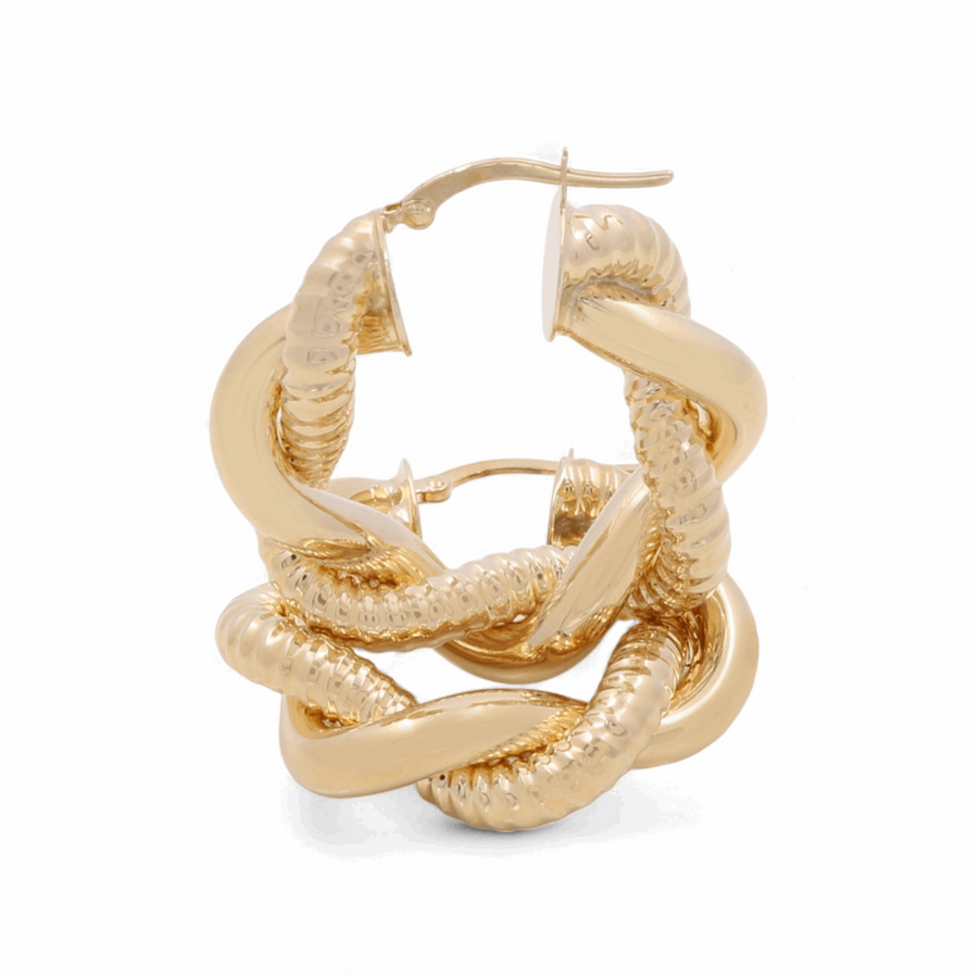 A luxurious and sophisticated pair of Miral Jewelry 14K Yellow Fashion Hoop Earrings, featuring an intertwined design with both textured and smooth finishes, elegantly showcased on a white background.