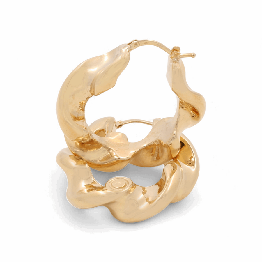 Miral Jewelry's 14K Yellow Fashion Hoop Earrings, arranged one atop the other against a pristine white backdrop, highlight their allure as sophisticated fashion accessories.