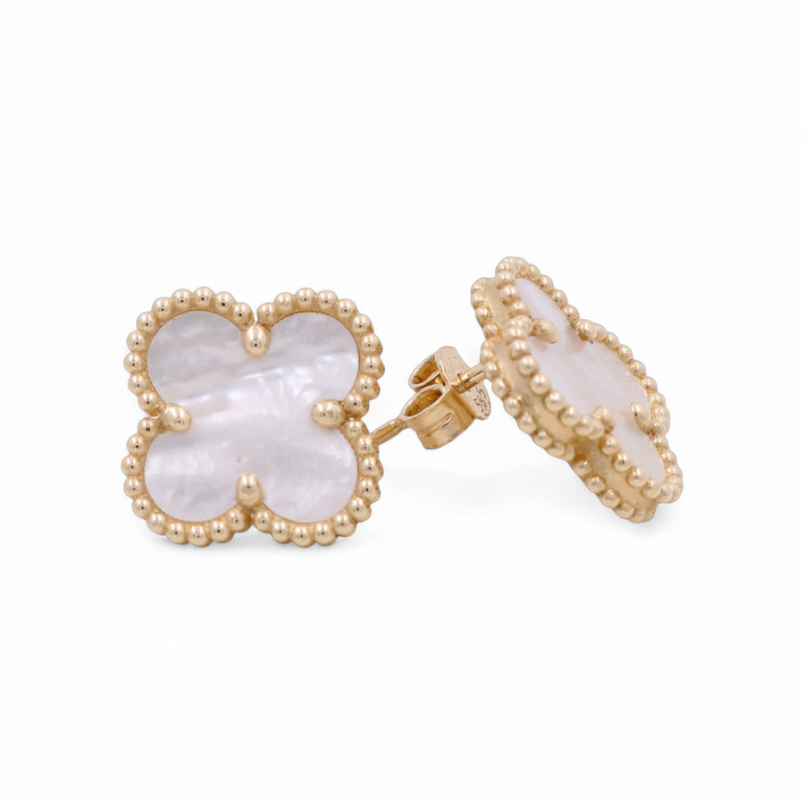 The 14K Yellow Gold Fashion Flowers Women's Earrings by Miral Jewelry feature a charming four-leaf clover design with mother-of-pearl inlay and beaded edges, adding an elegant floral touch.