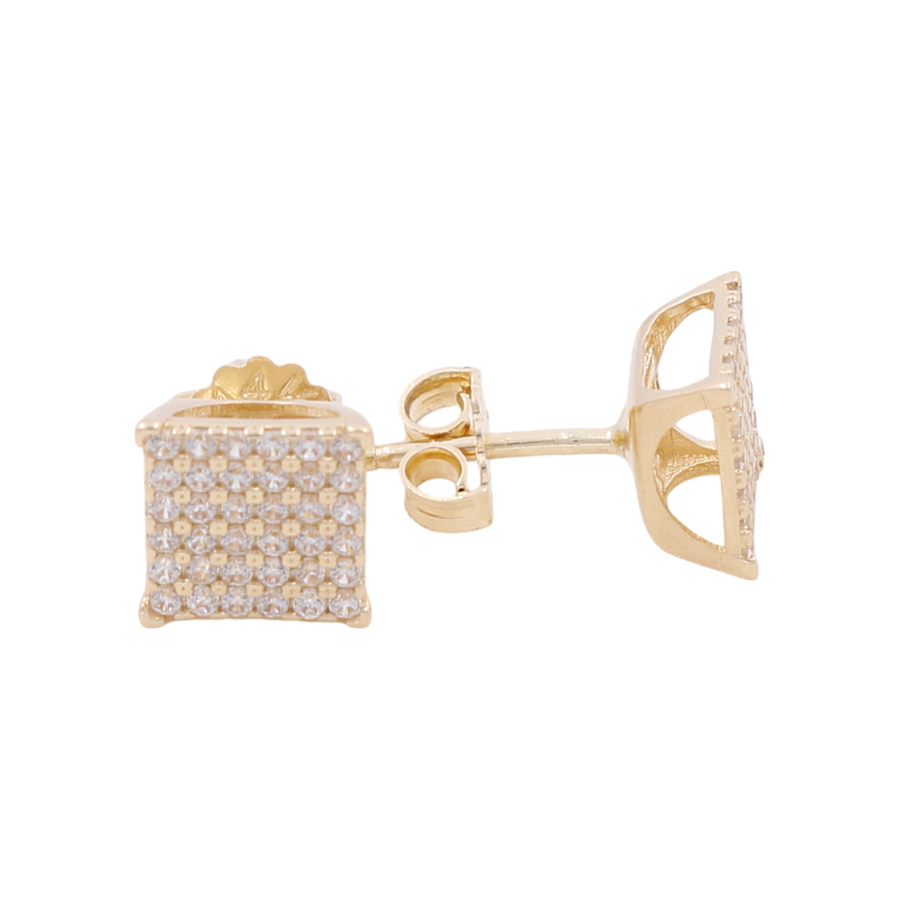 A pair of 14K yellow gold square-shaped stud earrings by Miral Jewelry featuring a grid of small diamonds.