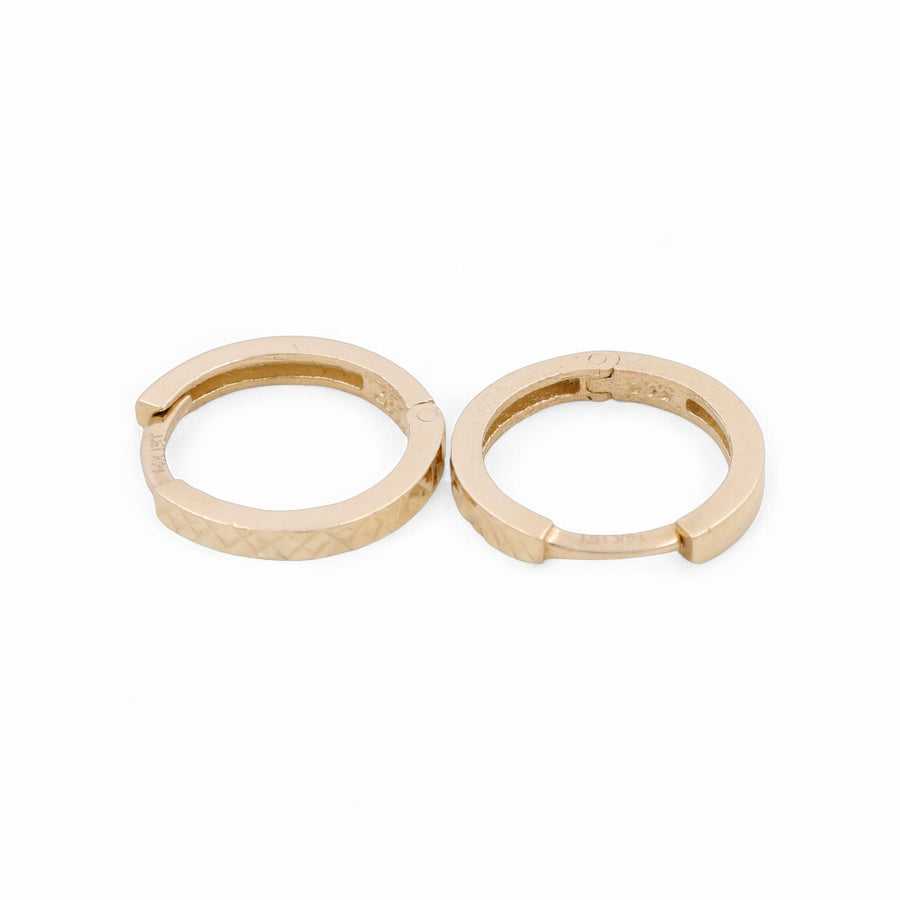 The 14K Yellow Fashion Hoops Earrings by Miral Jewelry are displayed side by side against a plain white background, showcasing their small, textured pattern and epitomizing fashion jewelry at its finest.