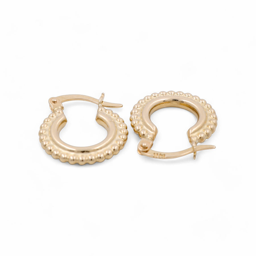 Presenting the 14K Yellow Gold Fashion Hoop Women's Earrings by Miral Jewelry, featuring intricate beaded detailing. Perfect for adding a touch of elegance to any fashion jewelry collection.