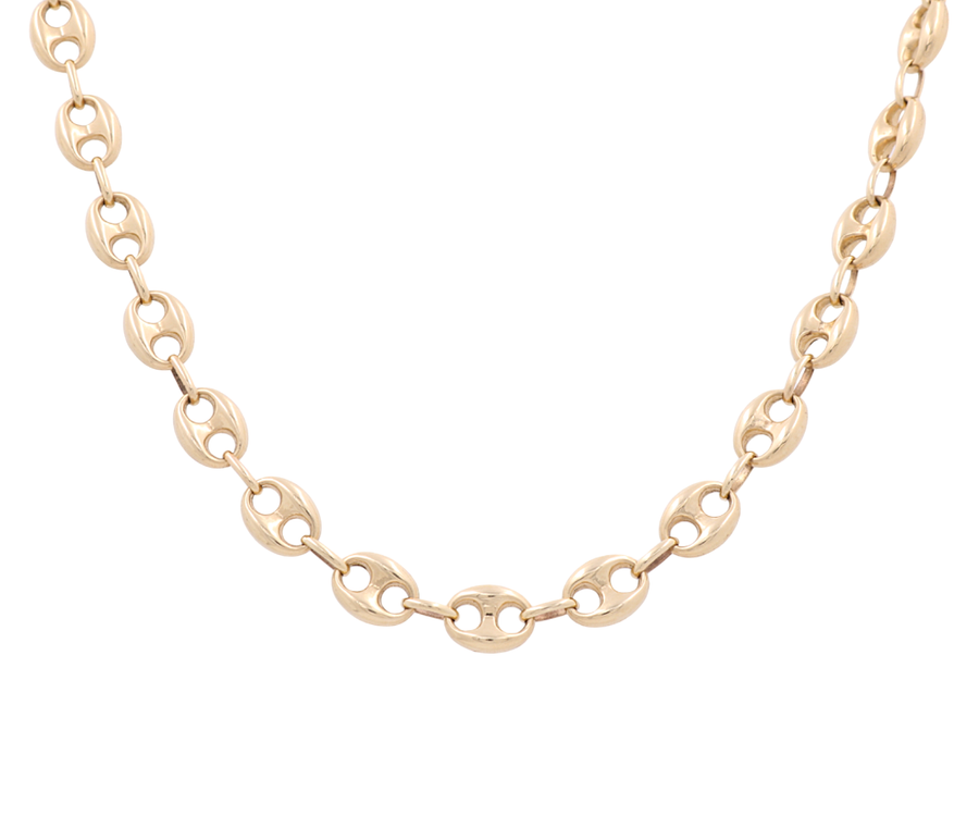 Description: The 14K Yellow Gold Marine Chain by Miral Jewelry is a timeless piece, featuring a gold chain necklace with oval-shaped links and small interlocking rings.