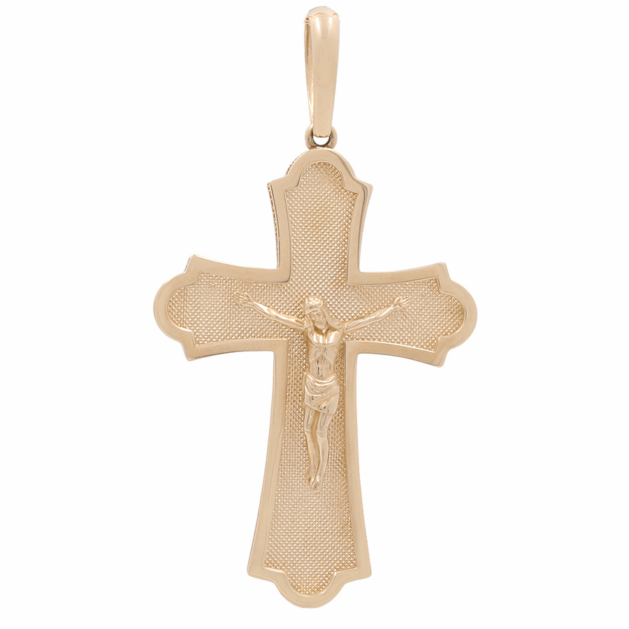 Miral Jewelry’s 14K Yellow Gold Cross Pendant, featuring Jesus on the cross, offers a stunning textured background with polished edges and shimmering zirconias.