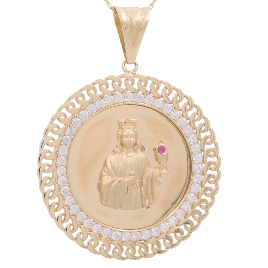 Close-up of the Miral Jewelry 14K Yellow Gold Round Religious Pendant with Zirconias, featuring an engraved figure holding an orb. The circular pendant boasts a decorative chain-like border embedded with small zirconias.