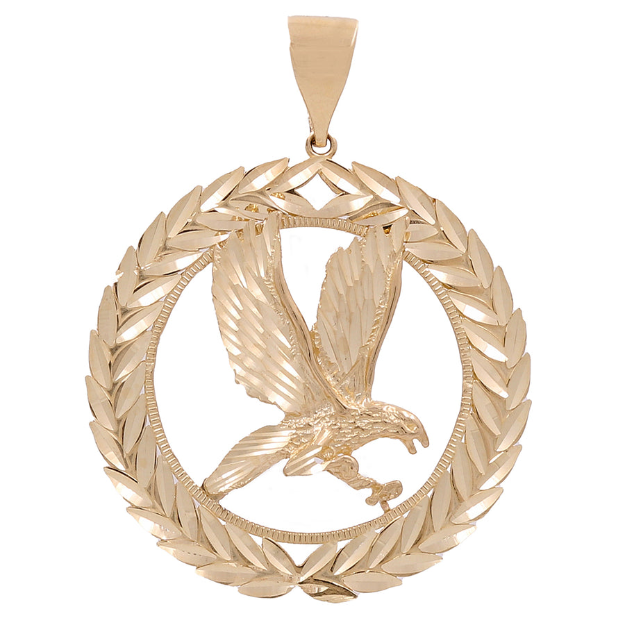 The 14K Yellow Gold Eagle with Wreath Pendant by Miral Jewelry features a stunning eagle in mid-flight, gracefully nestled inside a circular laurel wreath design. This statement piece of jewelry radiates elegance and sophistication.