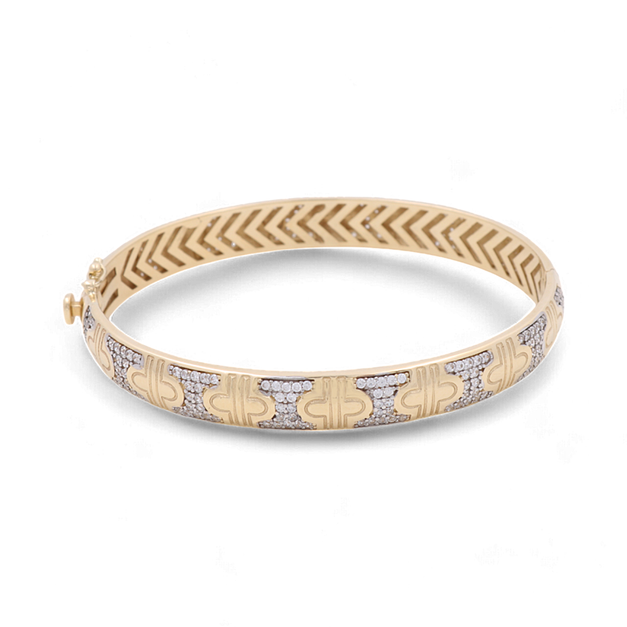 This 14K Yellow Gold Fashion Bracelet by Miral Jewelry, crafted with geometric detailing and clear, embedded stones along the outer edge, is a stunning addition to any jewelry collection.