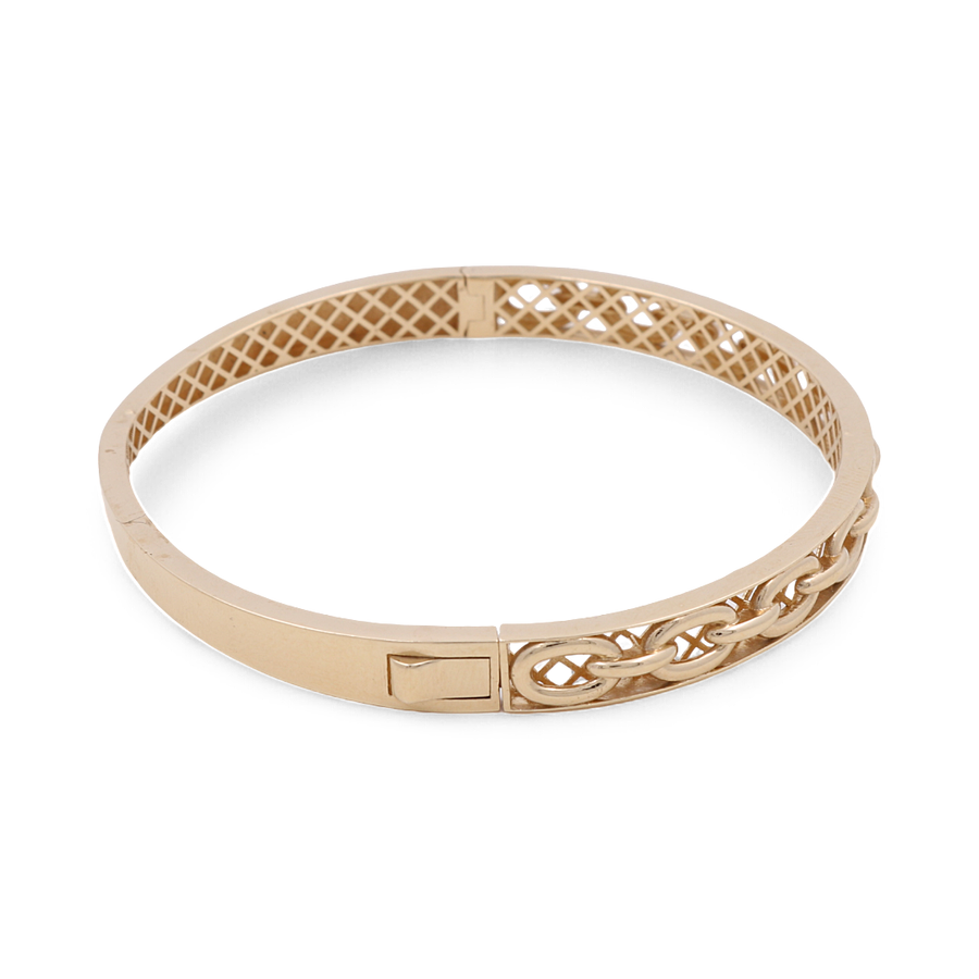 Discover the elegance of the 14K Yellow Gold Fashion Bracelet by Miral Jewelry, featuring a lattice interior pattern adorned with brilliant cubic zirconias and a striking chain-link design on one side.