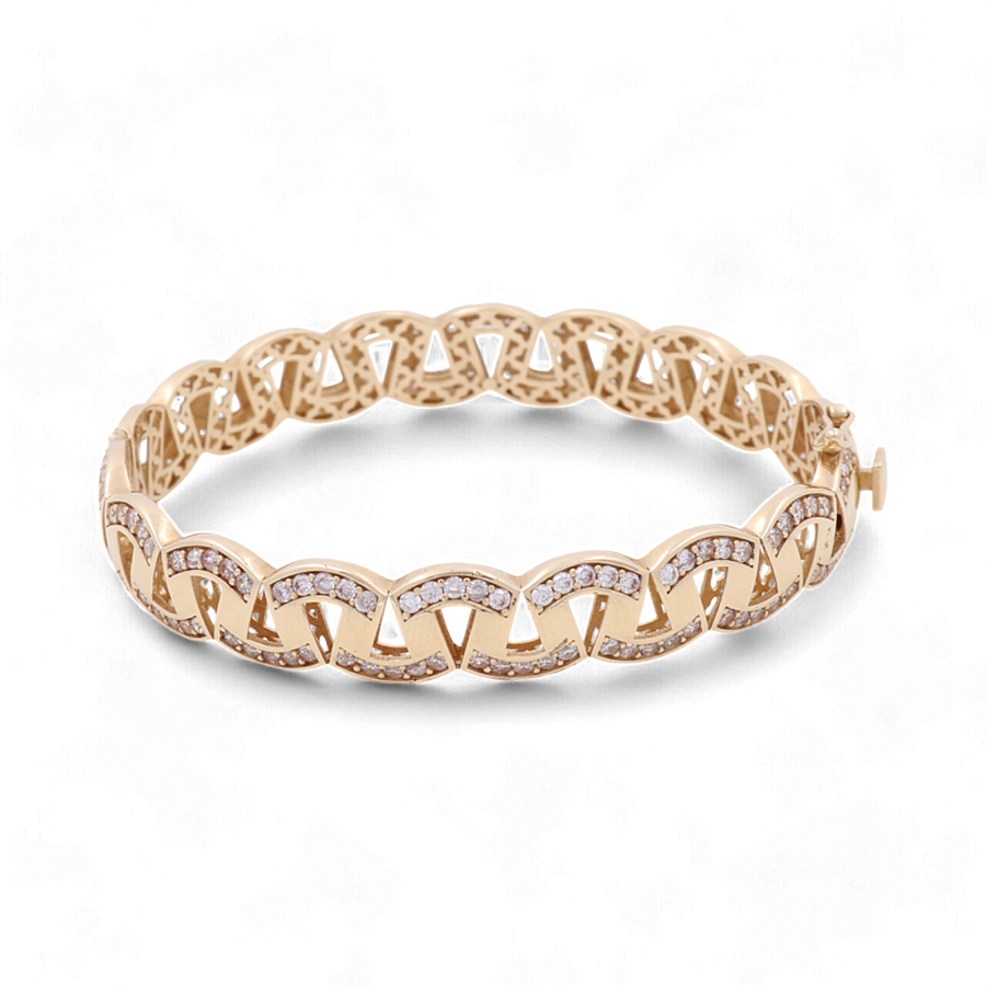 The 14K Yellow Gold Fashion Bracelet by Miral Jewelry features a linked chain design and is studded with small diamonds, epitomizing luxury jewelry.