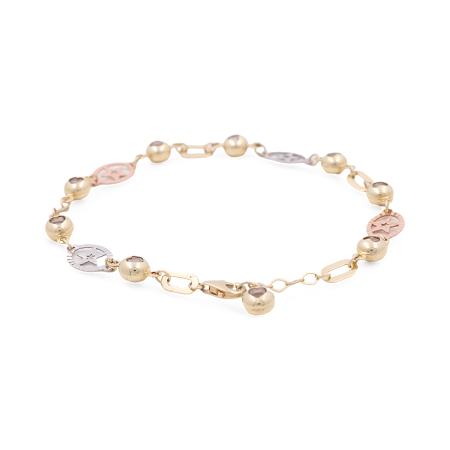 Discover the exquisite Tri-color 14k Fashion Bracelet by Miral Jewelry, boasting a captivating chain-link design with alternating gold, silver, and rose gold beads, fashion dolphins, and small circular pendants adorned with intricate engravings.