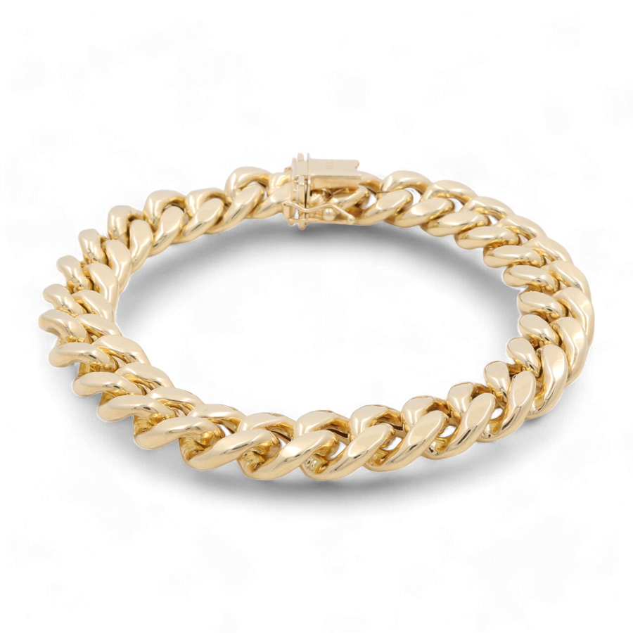 14K yellow gold chain bracelet with a clasp, displayed on a white background. This 14K Yellow Gold Fashion Cuban Links Bracelet by Miral Jewelry features exquisite fashion links perfect for any occasion.