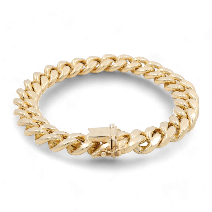 A wide, **Miral Jewelry 14K Yellow Gold Fashion Cuban Links Bracelet** with a box clasp closure.