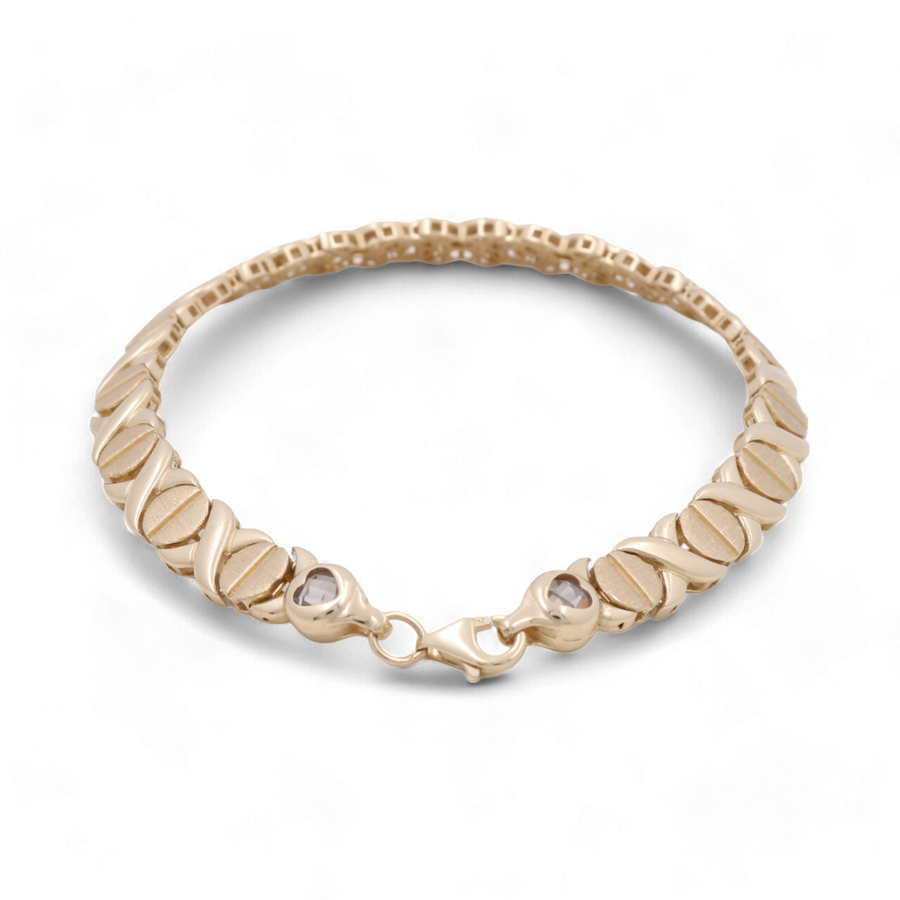 An elegant accessory, the 14K Yellow Gold Women's Fashion Link Bracelet by Miral Jewelry features a clasp and a pattern of alternating oval-shaped links.