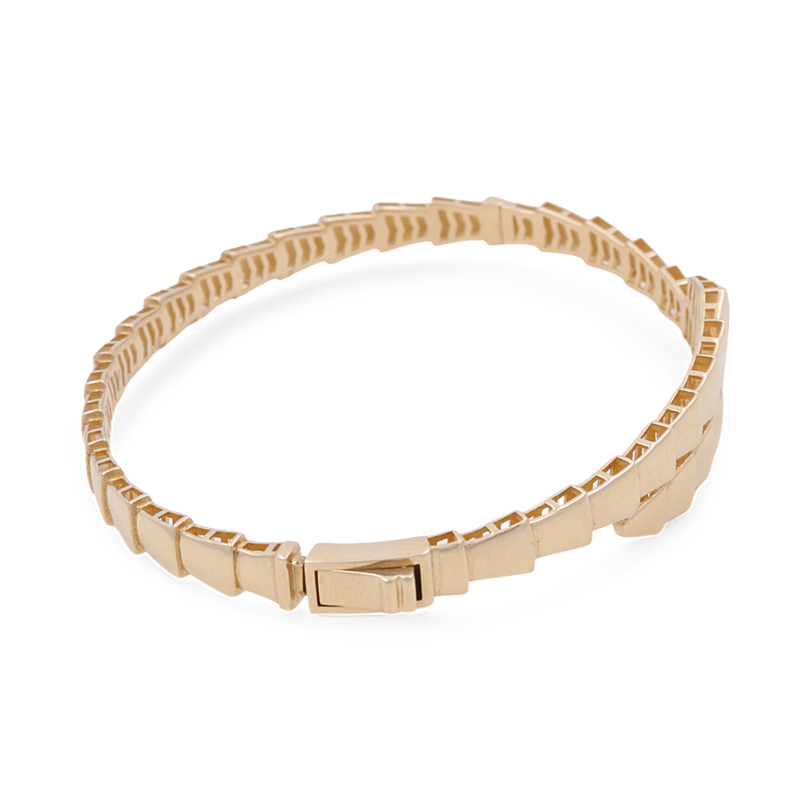 The Yellow Gold 14k Women's Fashion Bangle Bracelet by Miral Jewelry features a stunning geometric, interlocking design with a clasp closure, beautifully crafted from yellow gold.