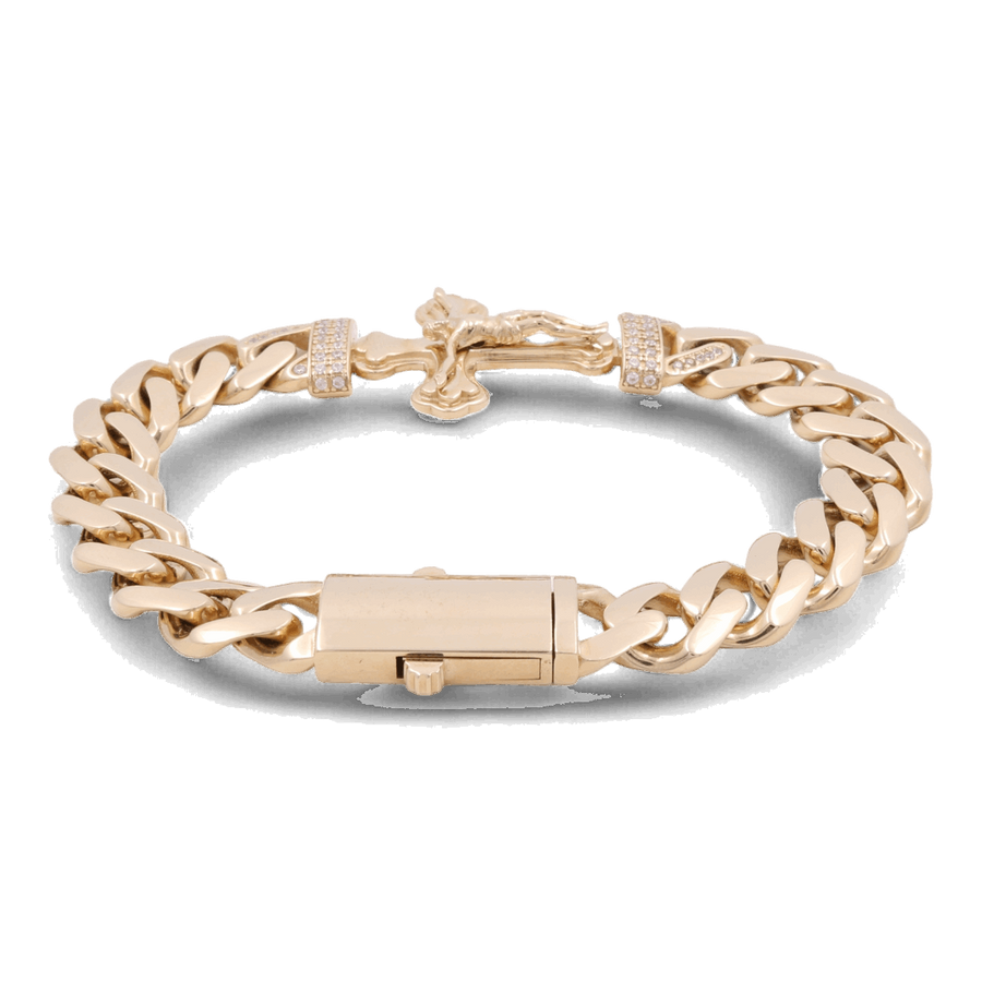 A stunning 14K Yellow Gold Fashion Cross with Cubic Zirconias Bracelet by Miral Jewelry, this fashion accessory features a secure clasp and decorative elements, all showcased on a sleek black background.